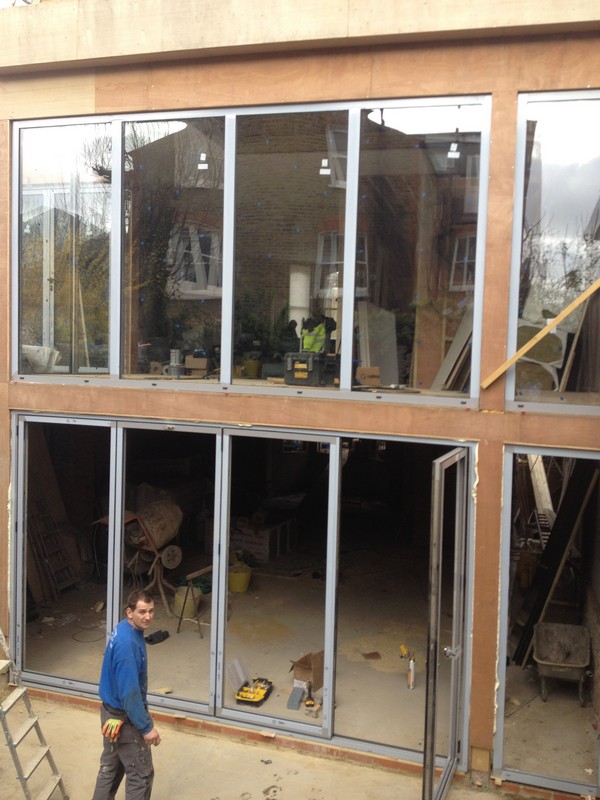 Aluminium bi-fold doors with two-storey glazing in Waltham Cross