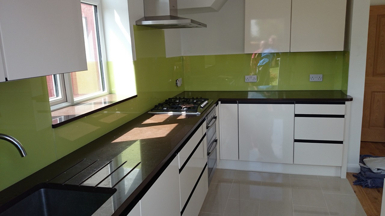 Lime green glass kitchen splashback installed by Waltham Cross glaziers