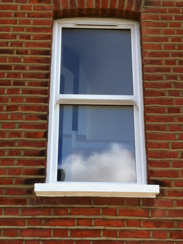 uPVC sash window on Victorian red brick house in Waltham Cross